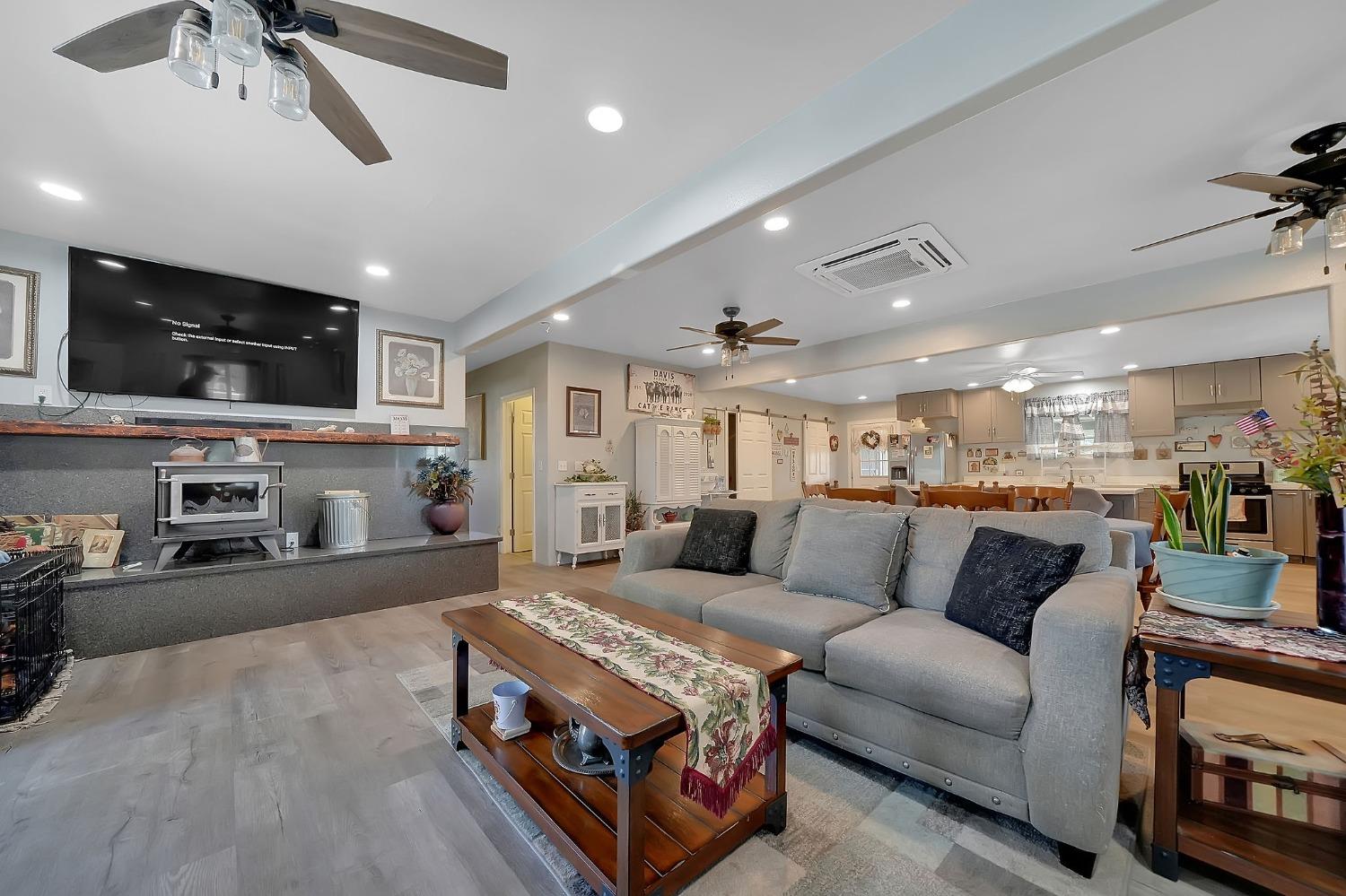 3585 South Burson Road Valley Springs, CA 95252 - Photo 65 of 99 a living room with furniture and a flat screen tv