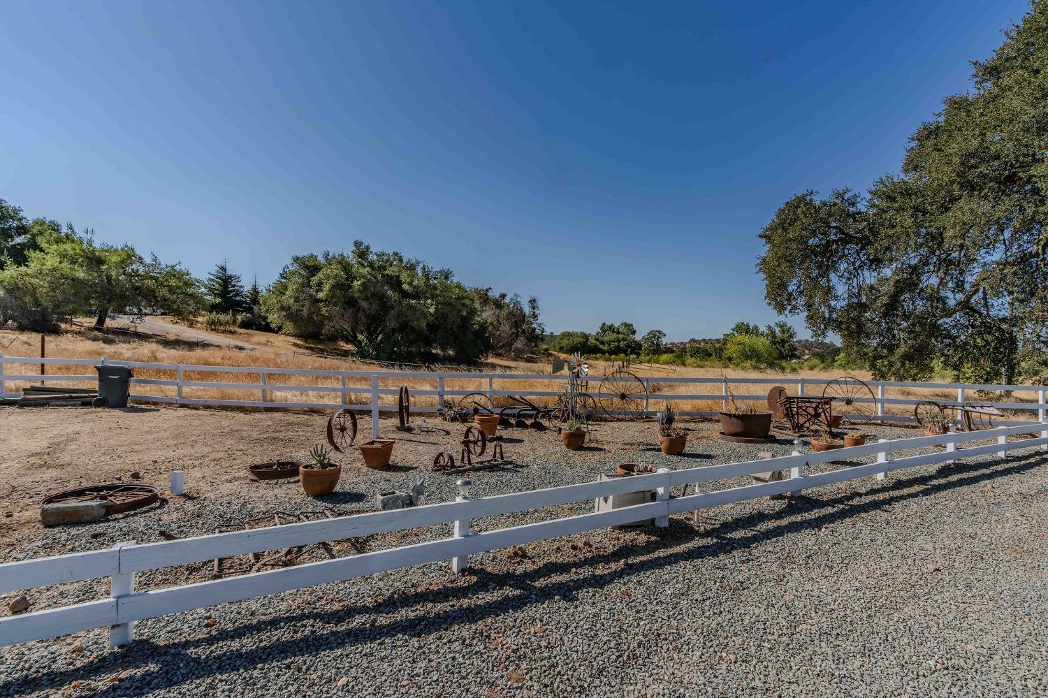 3585 South Burson Road Valley Springs, CA 95252 - Photo 8 of 99 a view of a yard with wooden fence