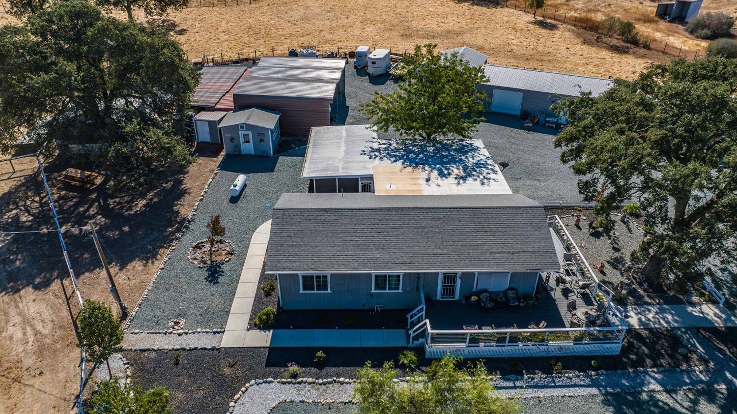 3585 South Burson Road Valley Springs, CA 95252 - Photo 84 of 99 an aerial view of a house with a yard and potted plants