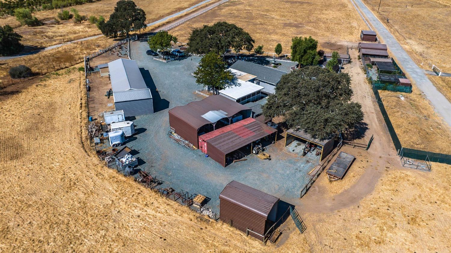 3585 South Burson Road Valley Springs, CA 95252 - Photo 89 of 99 an aerial view of a house with a yard and wooden fence