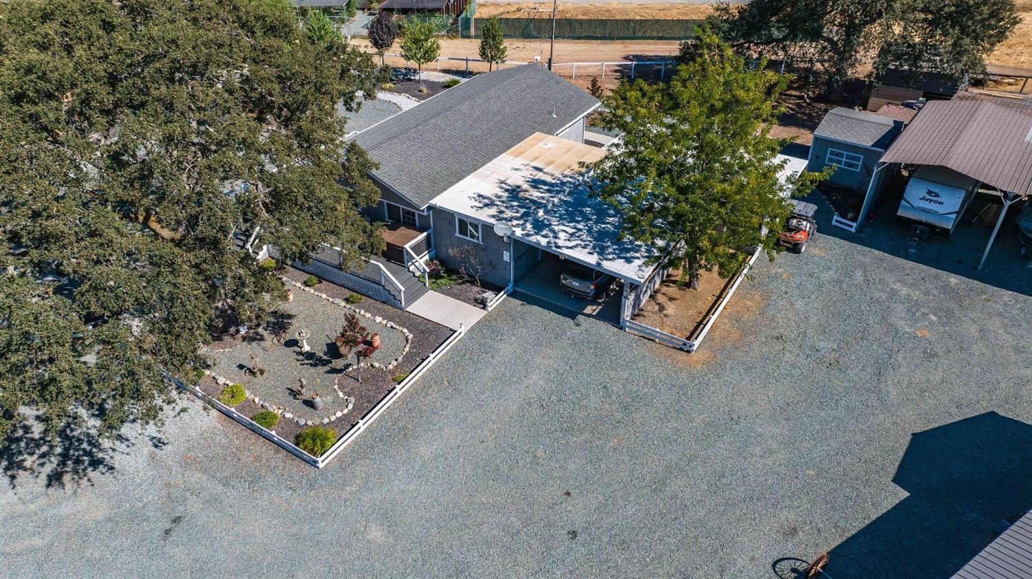 3585 South Burson Road Valley Springs, CA 95252 - Photo 90 of 99 an aerial view of a house with a yard and garden