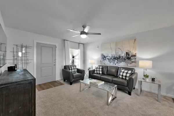 a living room with furniture and a table