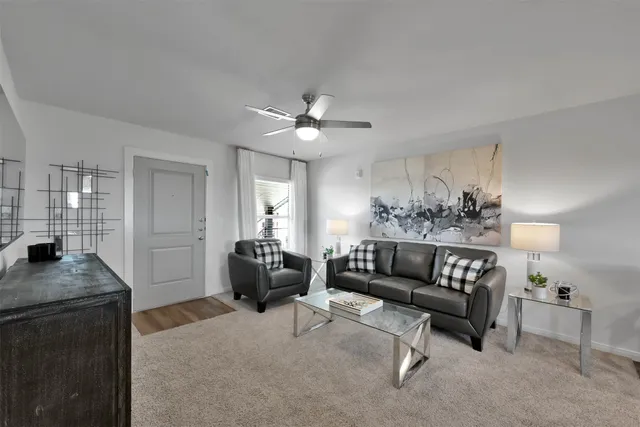 a living room with furniture and a table