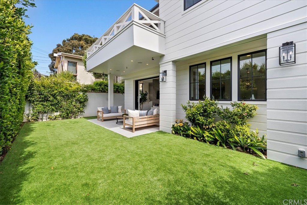 615 23rd Street Manhattan Beach, CA 90266 - Photo 12 of 36 a view of a chair and table in backyard of the house