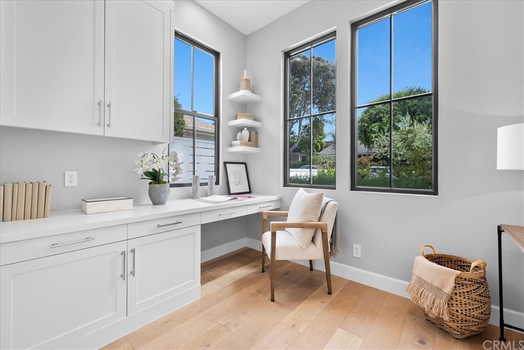 615 23rd Street Manhattan Beach, CA 90266 - Photo 15 of 36 a kitchen with a chair and white cabinets