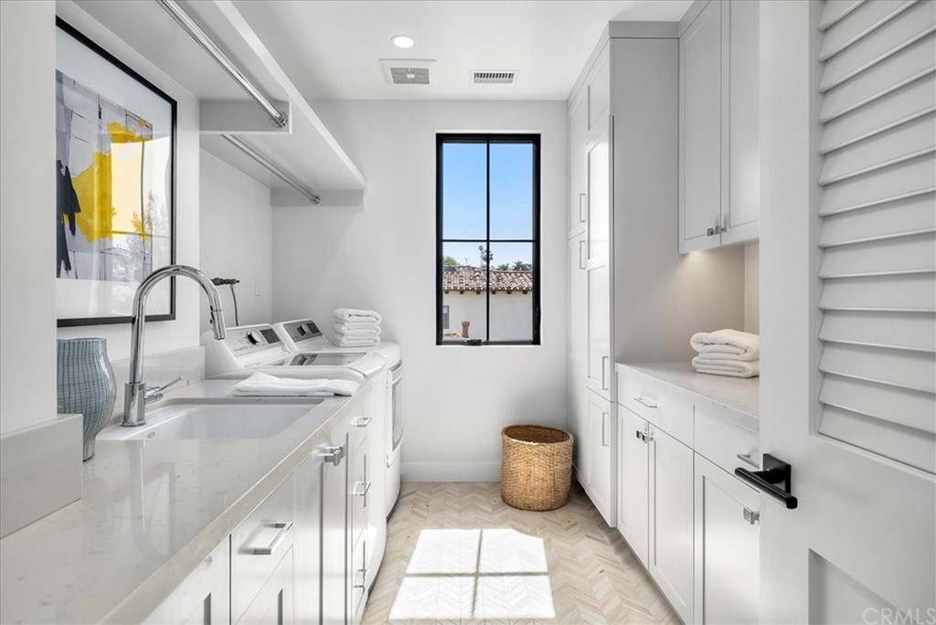615 23rd Street Manhattan Beach, CA 90266 - Photo 21 of 36 a bathroom with a granite countertop sink a toilet and mirror