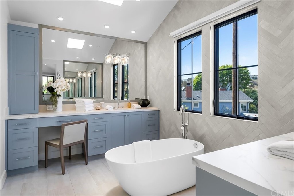 615 23rd Street Manhattan Beach, CA 90266 - Photo 24 of 36 a bathroom with a sink and a mirror