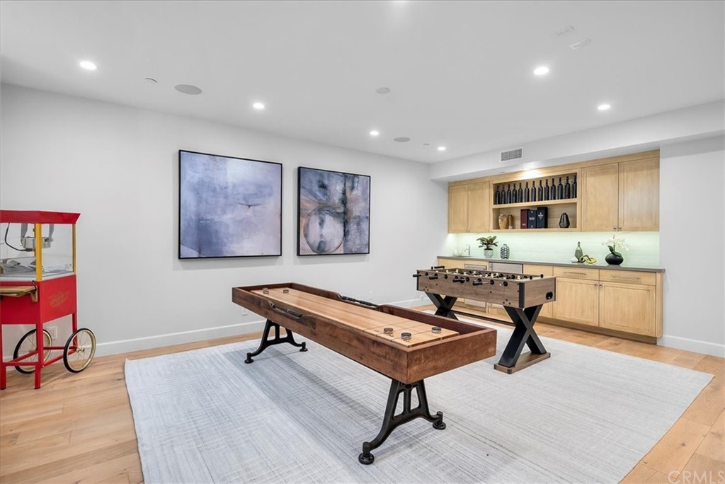 615 23rd Street Manhattan Beach, CA 90266 - Photo 30 of 36 a living room with furniture a table and kitchen view