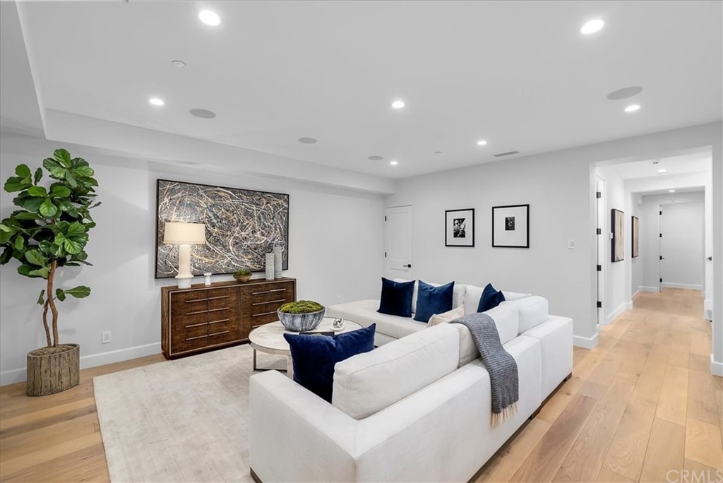 615 23rd Street Manhattan Beach, CA 90266 - Photo 31 of 36 a living room with furniture fireplace and potted plant