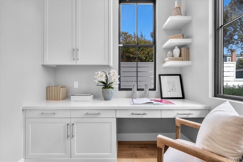 615 23rd Street Manhattan Beach, CA 90266 - Photo 35 of 36 a kitchen with white cabinets and a sink