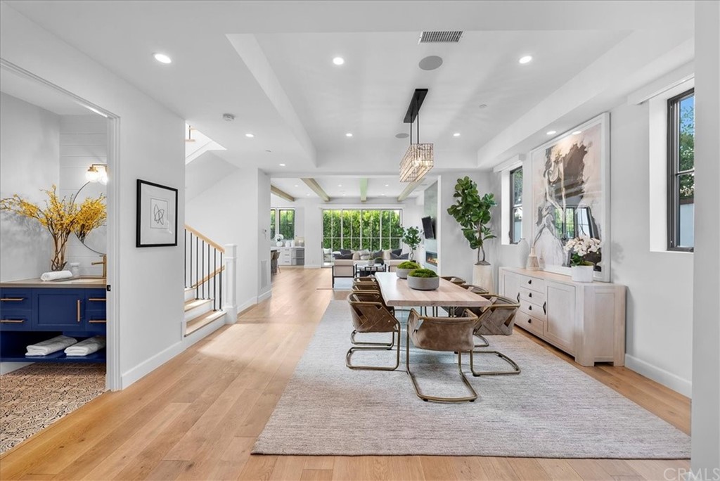 615 23rd Street Manhattan Beach, CA 90266 - Photo 4 of 36 a living room with furniture a large window and wooden floor