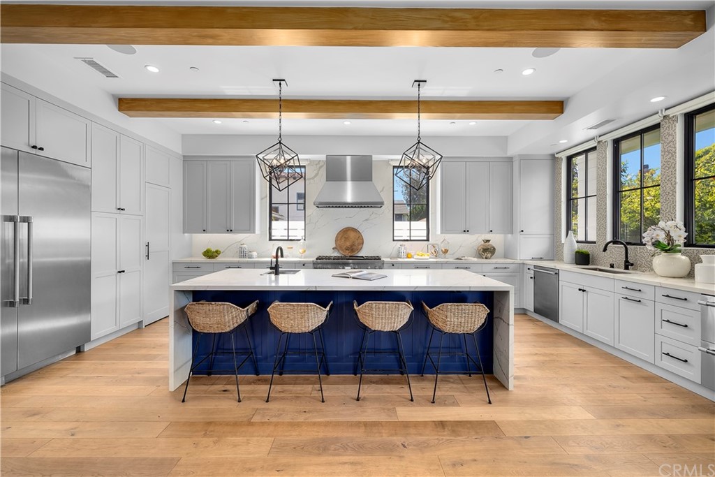 615 23rd Street Manhattan Beach, CA 90266 - Photo 5 of 36 a view of a kitchen with granite countertop a sink and cabinets