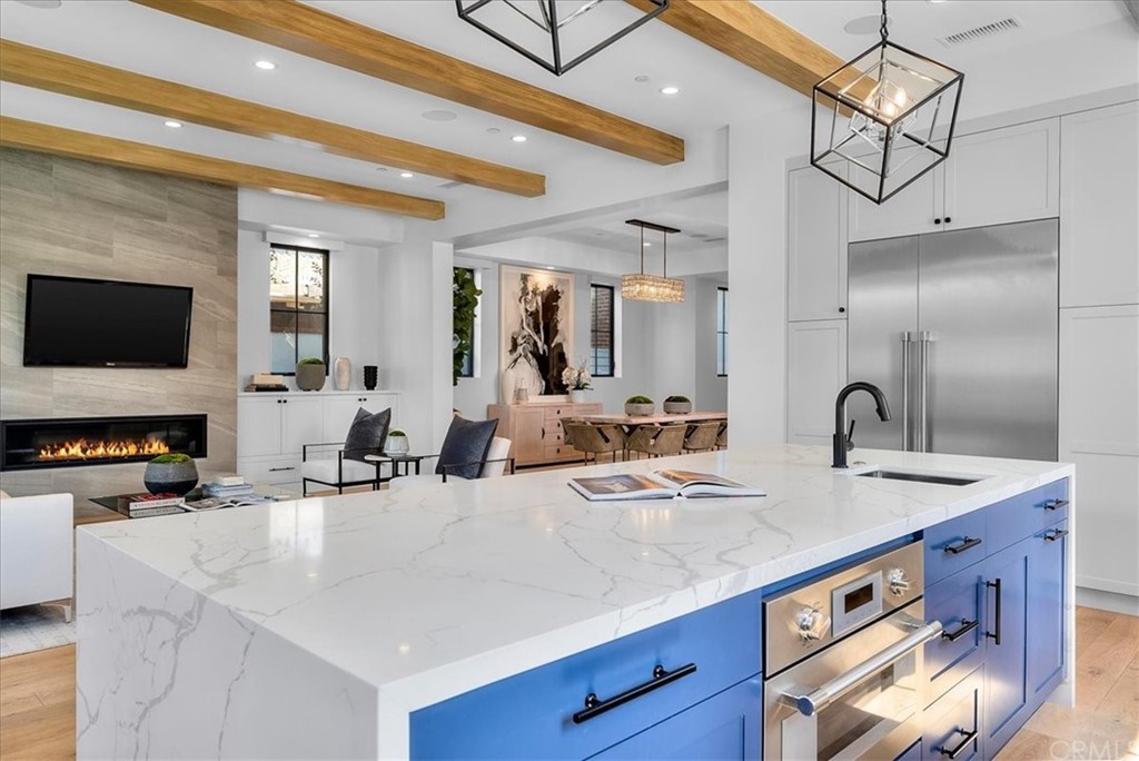 615 23rd Street Manhattan Beach, CA 90266 - Photo 7 of 36 a kitchen with stainless steel appliances a sink and a stove