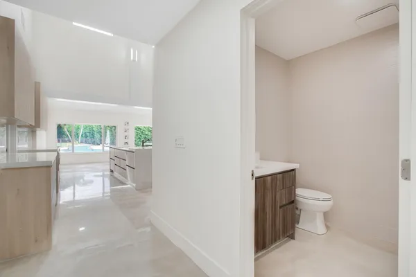 a view of bathroom with a toilet sink and a mirror