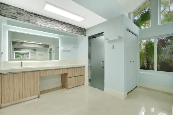 a bathroom with a sink and a mirror