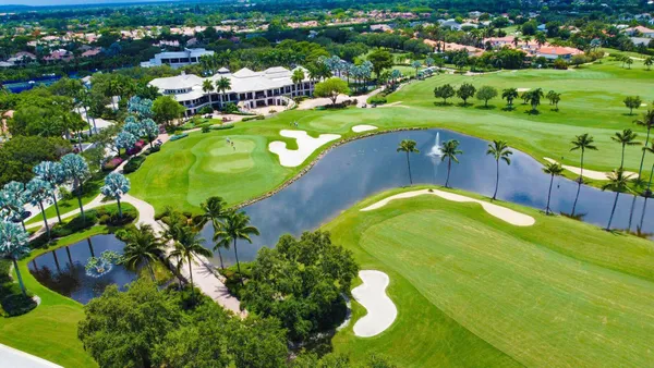 a view of a golf course with a swimming pool