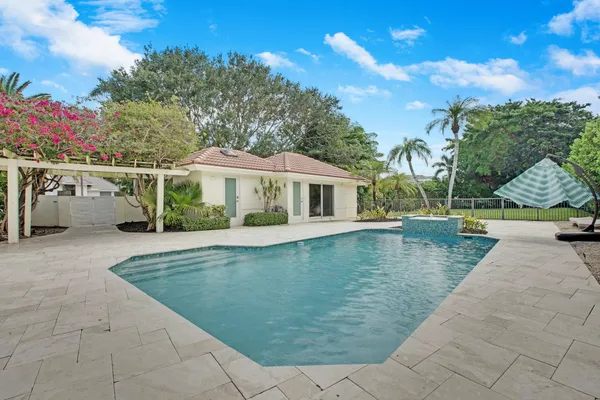 a view of a house with swimming pool