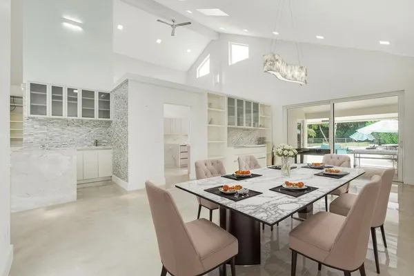 a view of a dining room and livingroom view with a large window