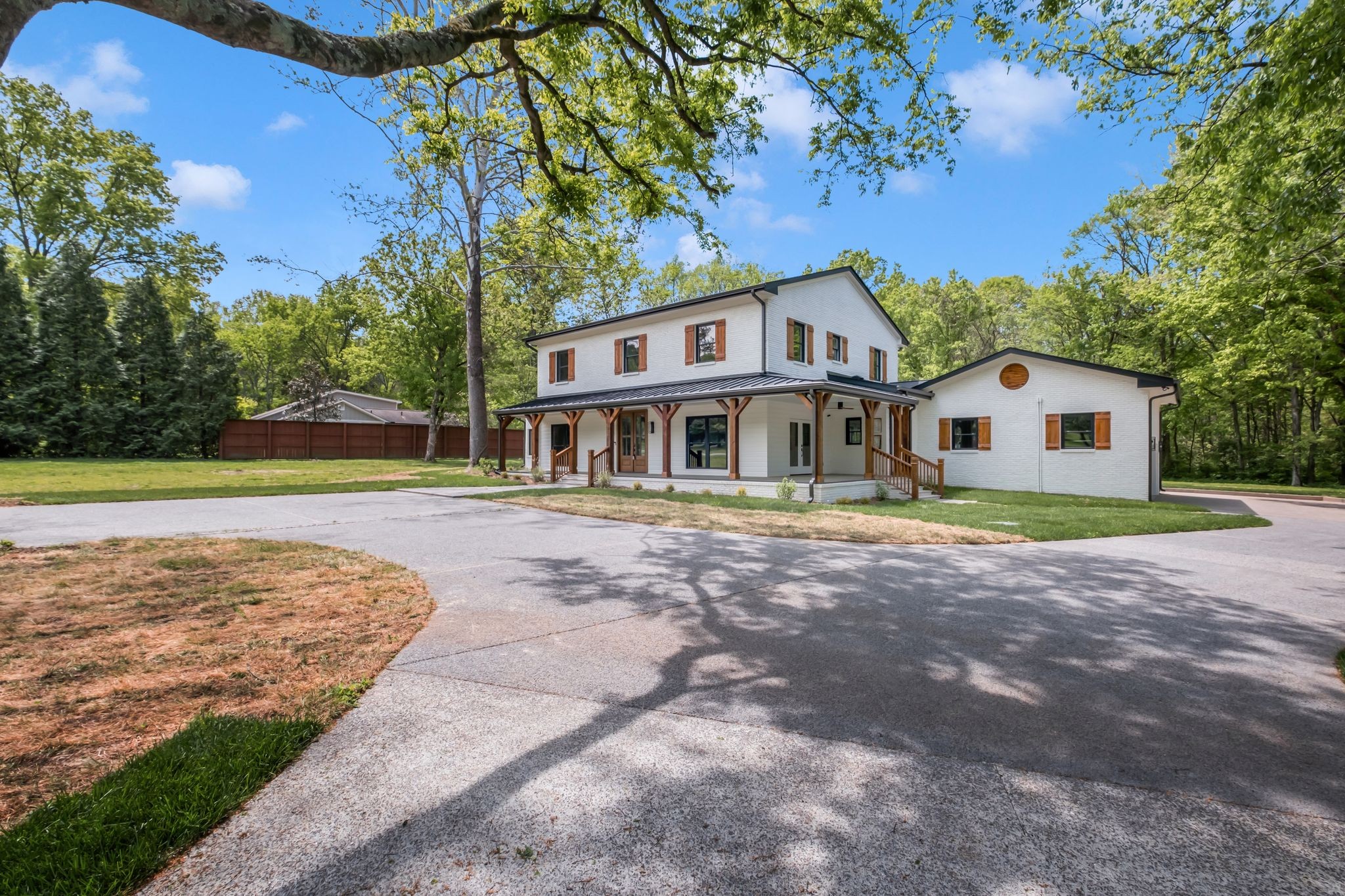 1120 Bradley Drive Franklin, TN 37069 - Photo 1 of 56 a front view of a house with garden