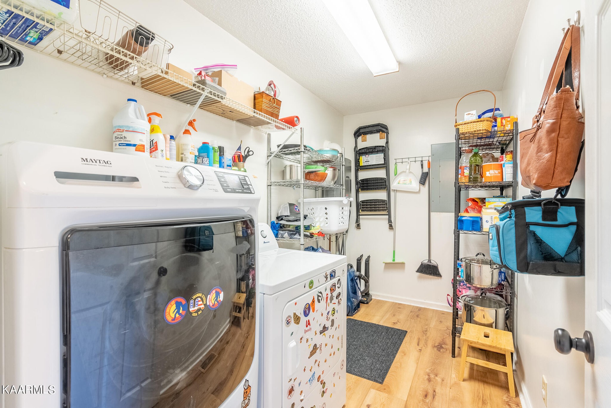 2038 Dutch Valley Road Clinton, TN 37716 - Photo 17 of 51 a utility room with fridge and wooden floor
