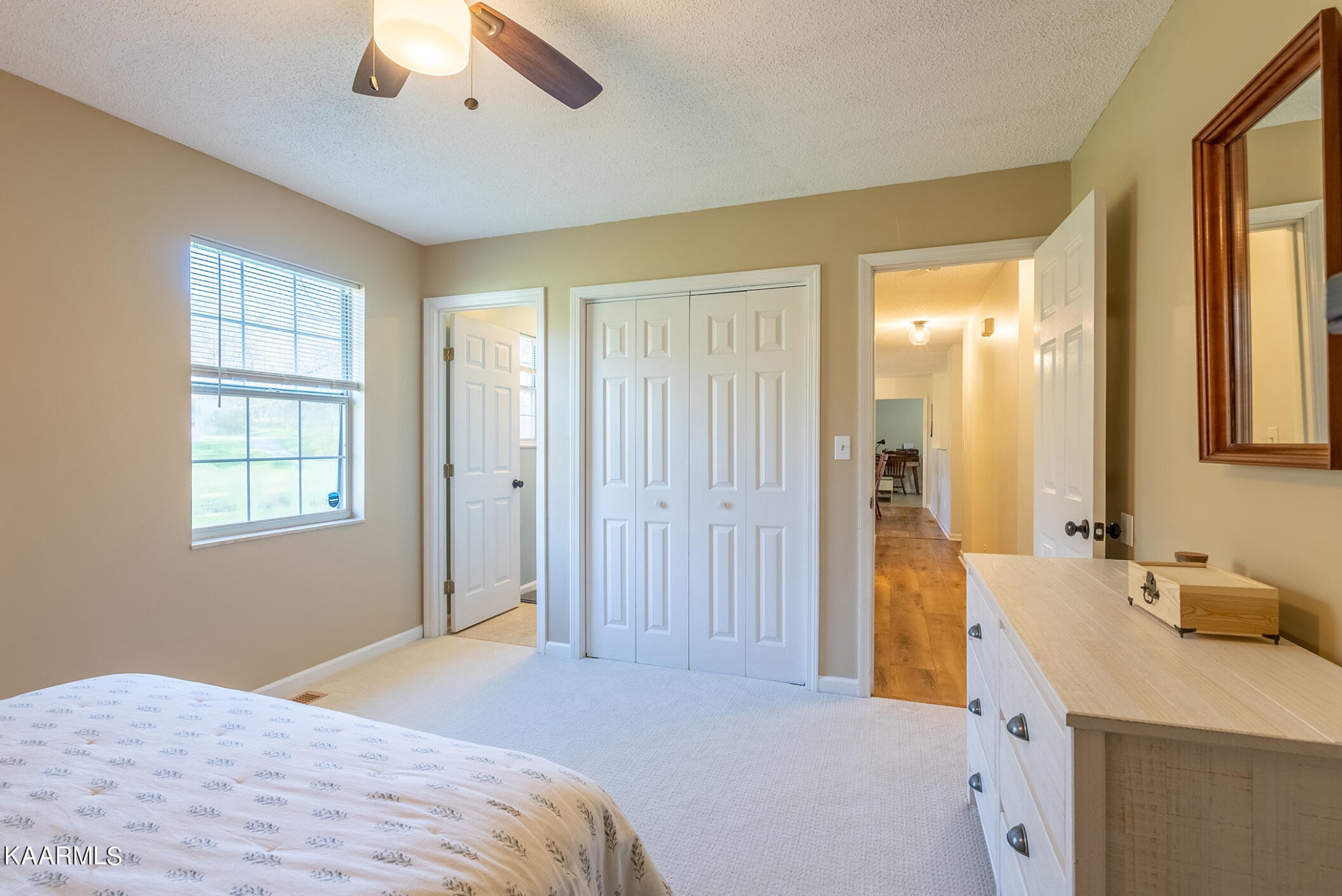 2038 Dutch Valley Road Clinton, TN 37716 - Photo 23 of 51 a spacious bedroom with a sink and a mirror