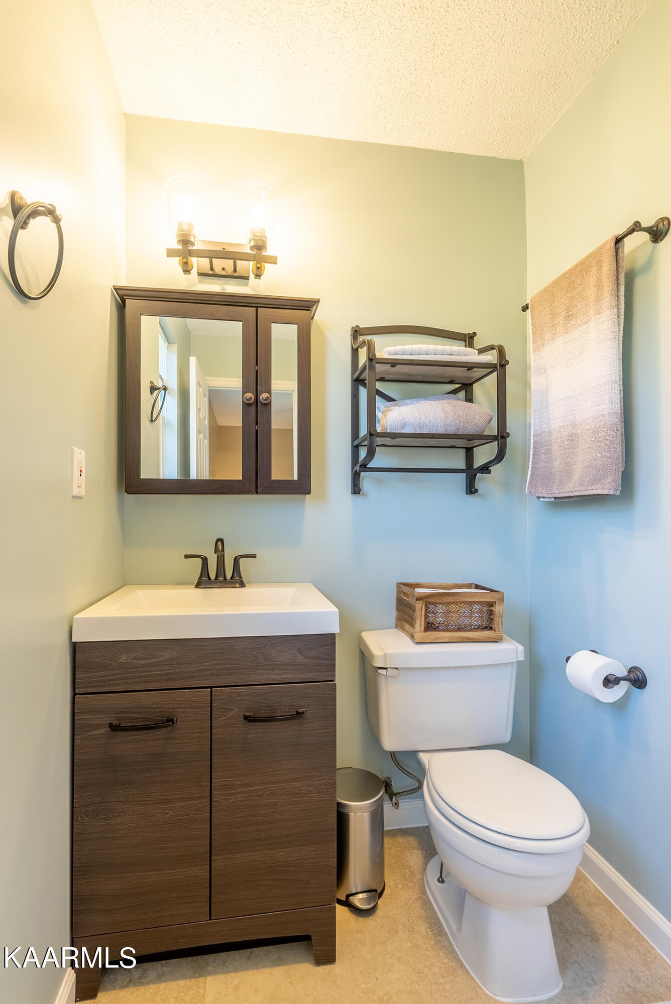 2038 Dutch Valley Road Clinton, TN 37716 - Photo 24 of 51 a bathroom with a toilet a sink and mirror