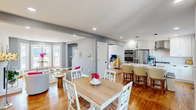 a view of kitchen with dining table and chairs