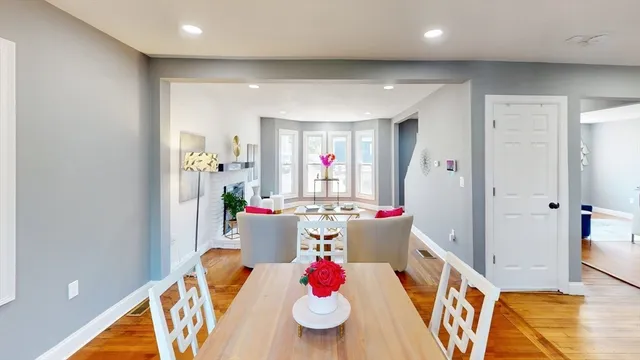 a view of dining room with furniture and wooden floor