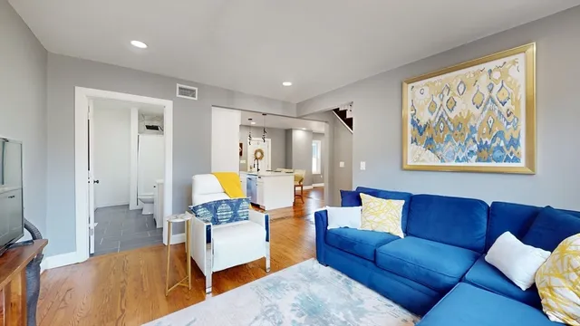 a living room with furniture or couch and a potted plant