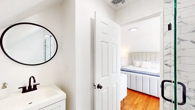 a bathroom with a sink and a mirror