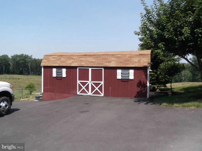 8344 Settle School Road Rixeyville, VA 22737 - Photo 18 of 30 a view of a house with a yard and parking space