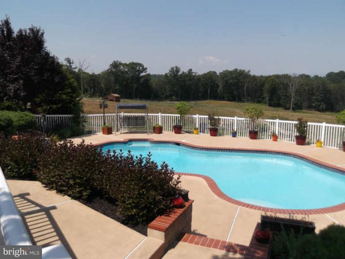 8344 Settle School Road Rixeyville, VA 22737 - Photo 19 of 30 a view of a swimming pool with a patio
