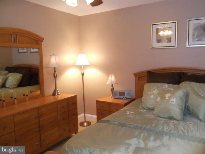8344 Settle School Road Rixeyville, VA 22737 - Photo 21 of 30 a bedroom with a bed and a night stand