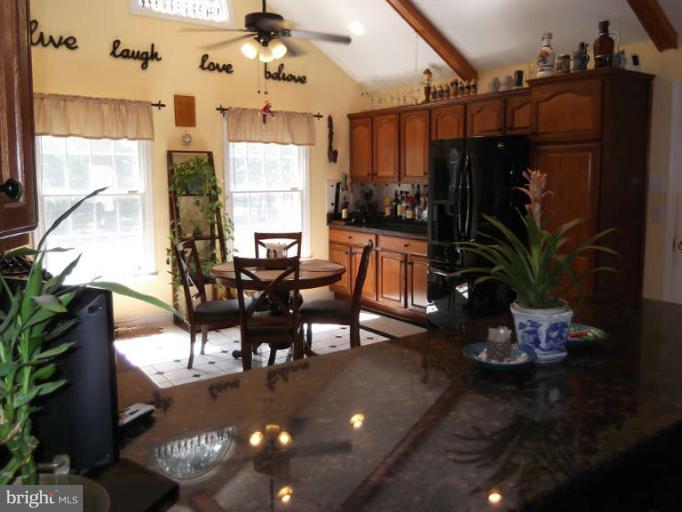 8344 Settle School Road Rixeyville, VA 22737 - Photo 22 of 30 a view of a dining room with furniture window and outside view