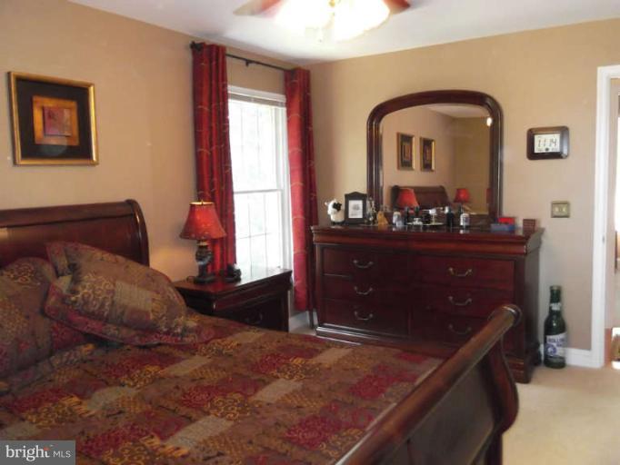 8344 Settle School Road Rixeyville, VA 22737 - Photo 23 of 30 a bedroom with a bed and a dresser