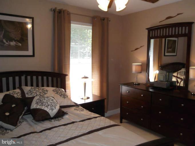 8344 Settle School Road Rixeyville, VA 22737 - Photo 26 of 30 a bedroom with a bed and a dresser