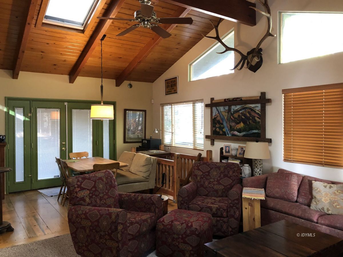 52572 Idyllmont Road Idyllwild, CA 92549 - Photo 3 of 13 a living room with furniture and a large window