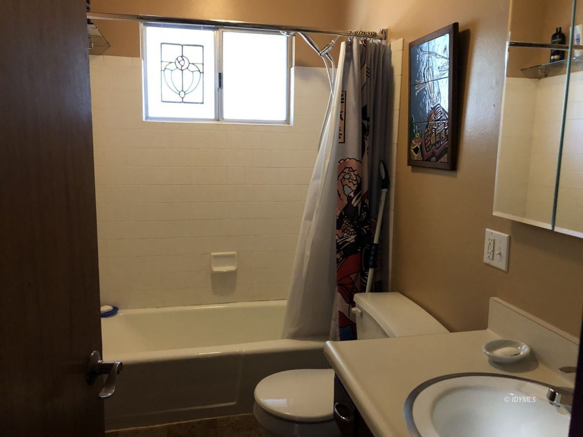 52572 Idyllmont Road Idyllwild, CA 92549 - Photo 7 of 13 a bathroom with a sink toilet and shower