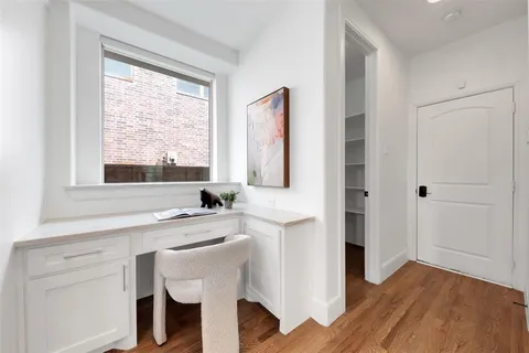 a kitchen with a sink cabinets and a window