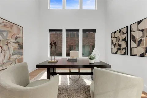 a view of a dining room with furniture and window