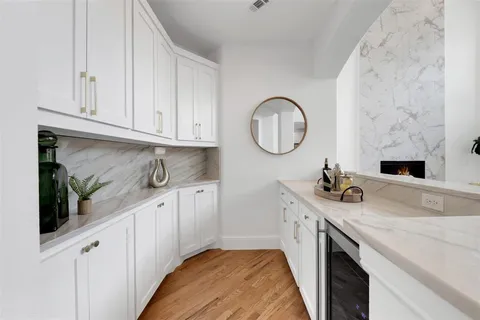 a kitchen with sink cabinets and stove