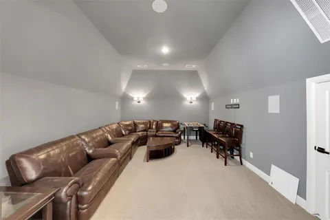 a living room with furniture and a piano
