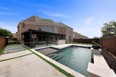 a view of a house with a swimming pool