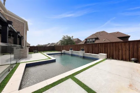 a view of swimming pool with lounge chair