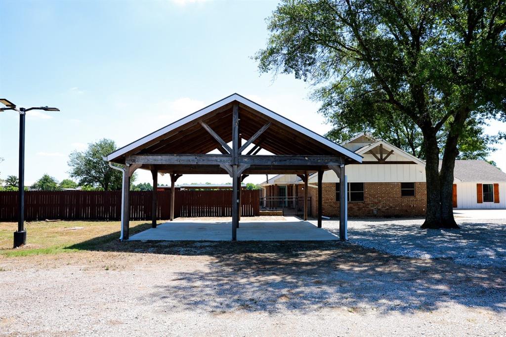 10575 Friendship Road Pilot Point, TX 76258 - Photo 15 of 32 Wood-framed carport with a concrete pad