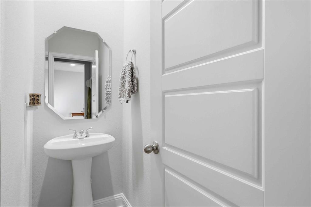 6092 Bursey Road Watauga, TX 76148 - Photo 11 of 23 a bathroom with a sink and a mirror