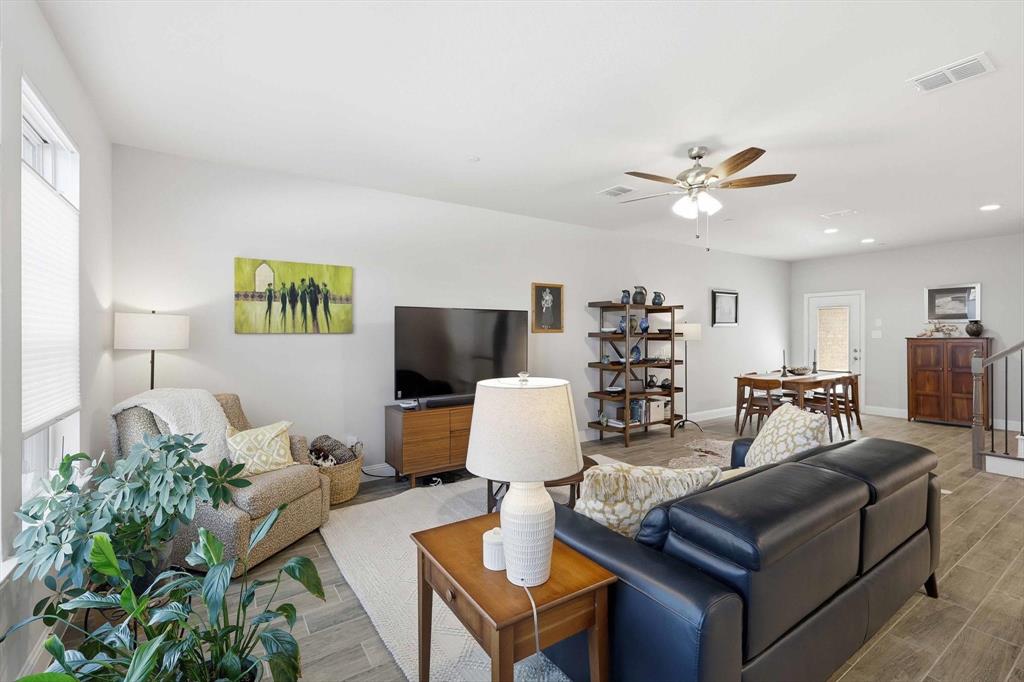 6092 Bursey Road Watauga, TX 76148 - Photo 7 of 23 a living room with furniture and wooden floor