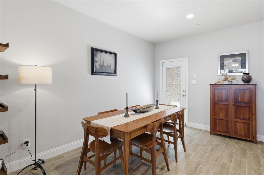 6092 Bursey Road Watauga, TX 76148 - Photo 10 of 23 a view of a dining room with furniture and wooden floor