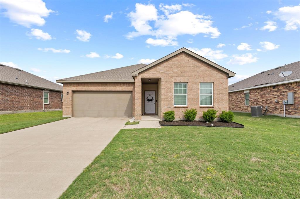 1823 Wolf Run Anna, TX 75409 - Photo 1 of 1 a view of a house with a yard and garage
