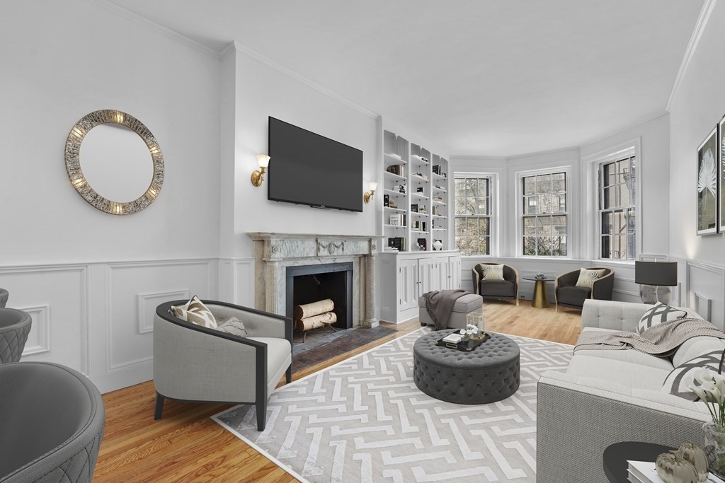 125 Beacon Street, Unit 5 Boston, MA 02116 - Photo 1 of 13 a living room with furniture a fireplace and a flat screen tv